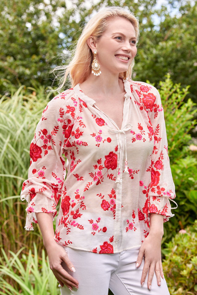 red and white floral blouse